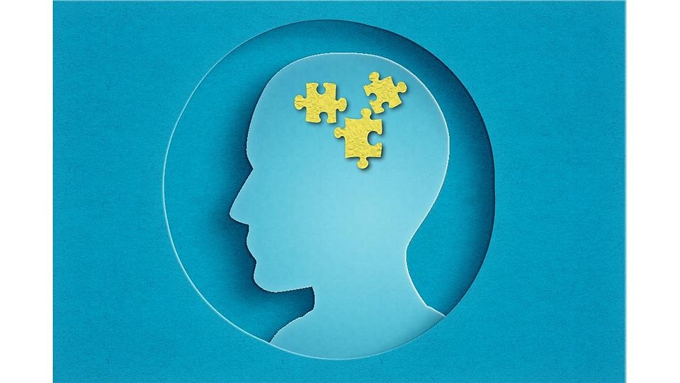 Animerad bild på en blå skalle med gula pusselbitar i "hjärnan"